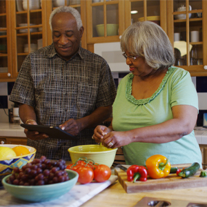 A couple cooking a healthy meal knowing a healthy digestive system is essential for the body to function properly.